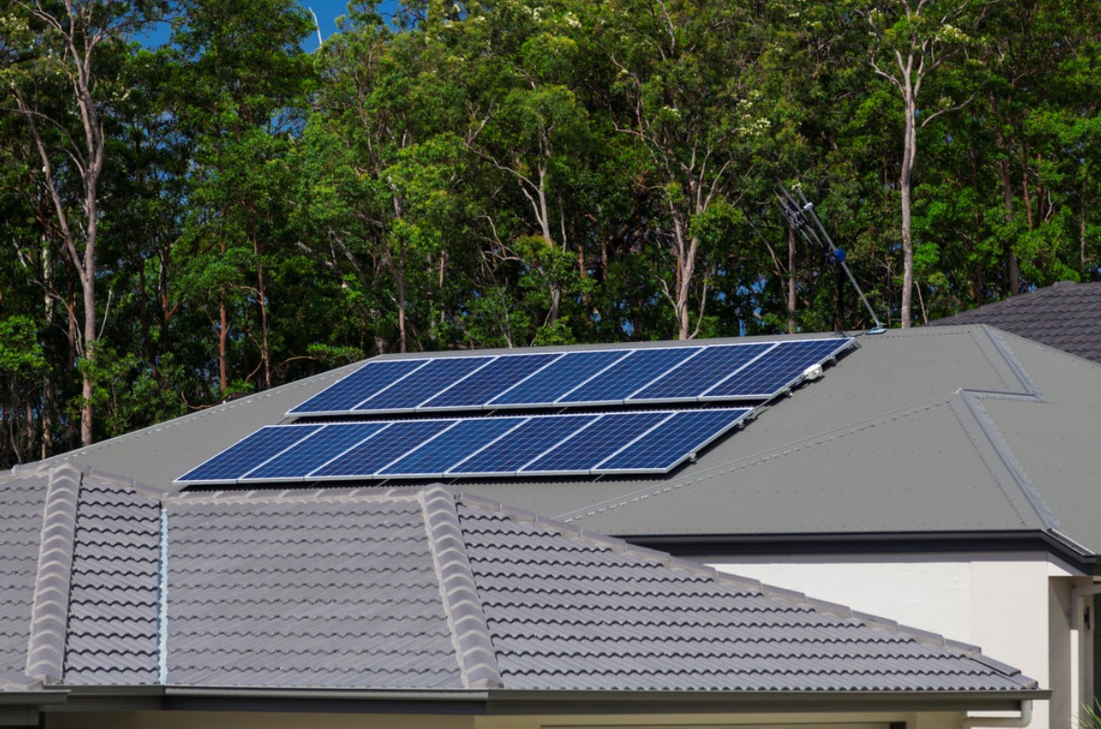 Solar System Installation on Woodland Grey roof with gumtree's in background